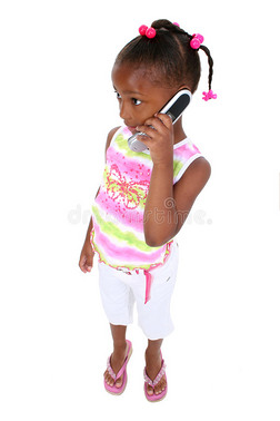 股票摄影：可爱的小女孩拿着手机站着