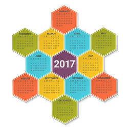 日历为2017年在明亮的彩色六角形背景。 一周从星期天开始。 矢量设计打印模板。